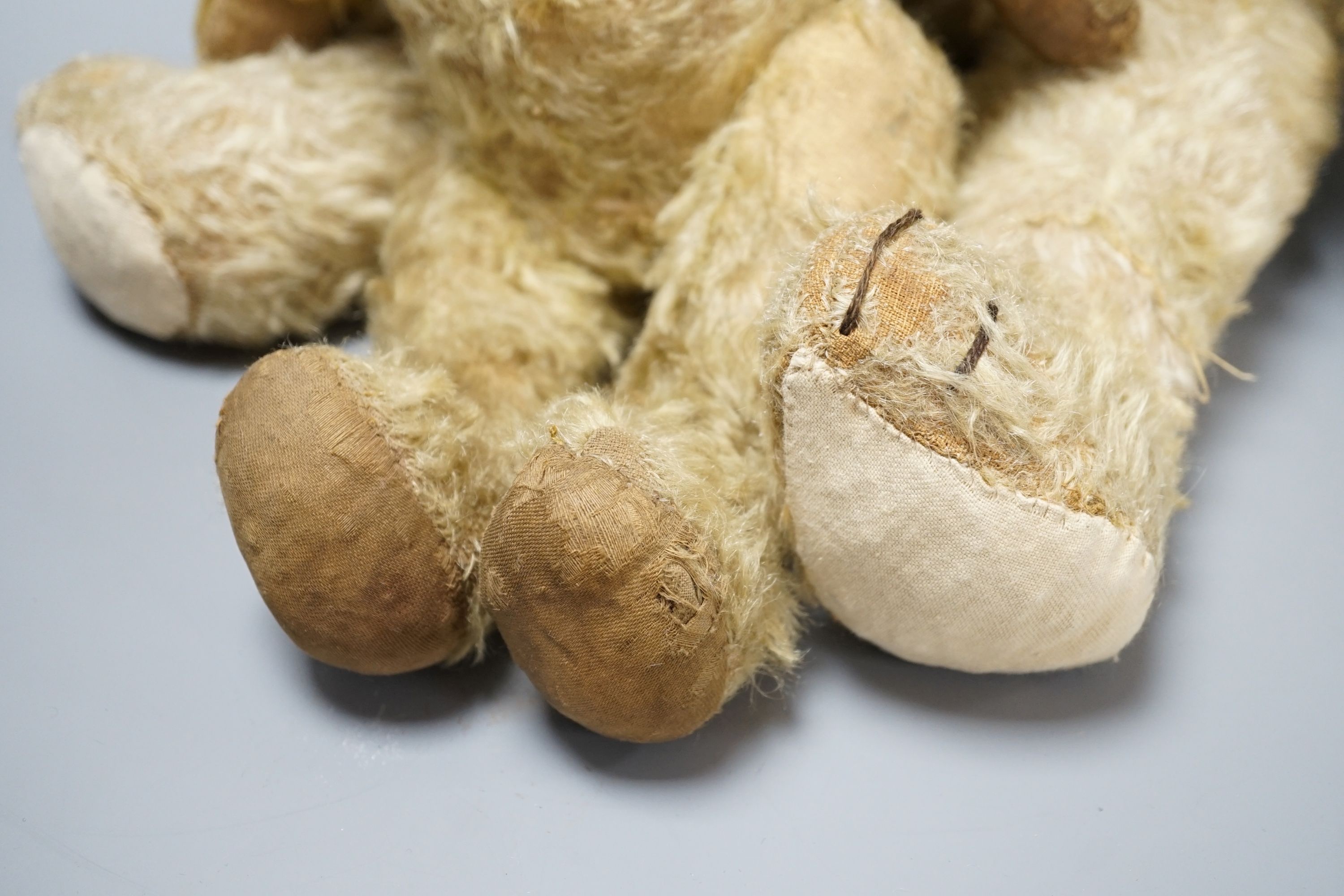 A large 1920's Chad Valley Teddy bear, 75cm, together with another 1920's Chad Valley Teddy bear, play-worn